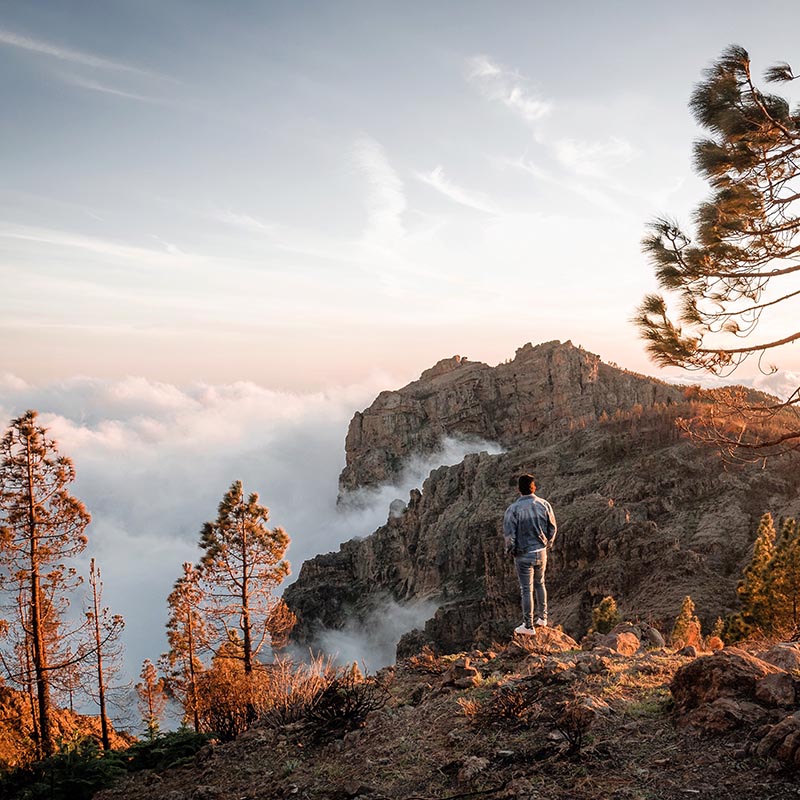 young-man-enjoying-sea-of-clouds-sunset-among-the-2021-04-05-13-02-29-utc-copy.jpg